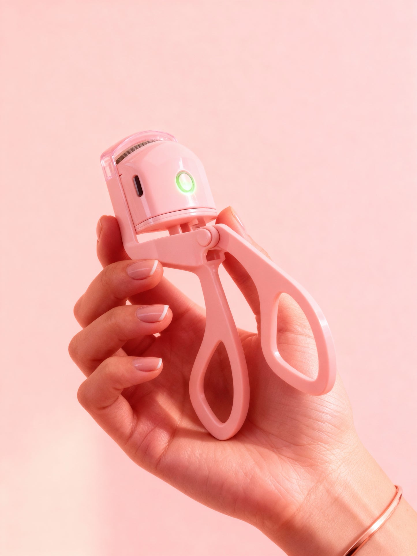 Heated eyelash curler